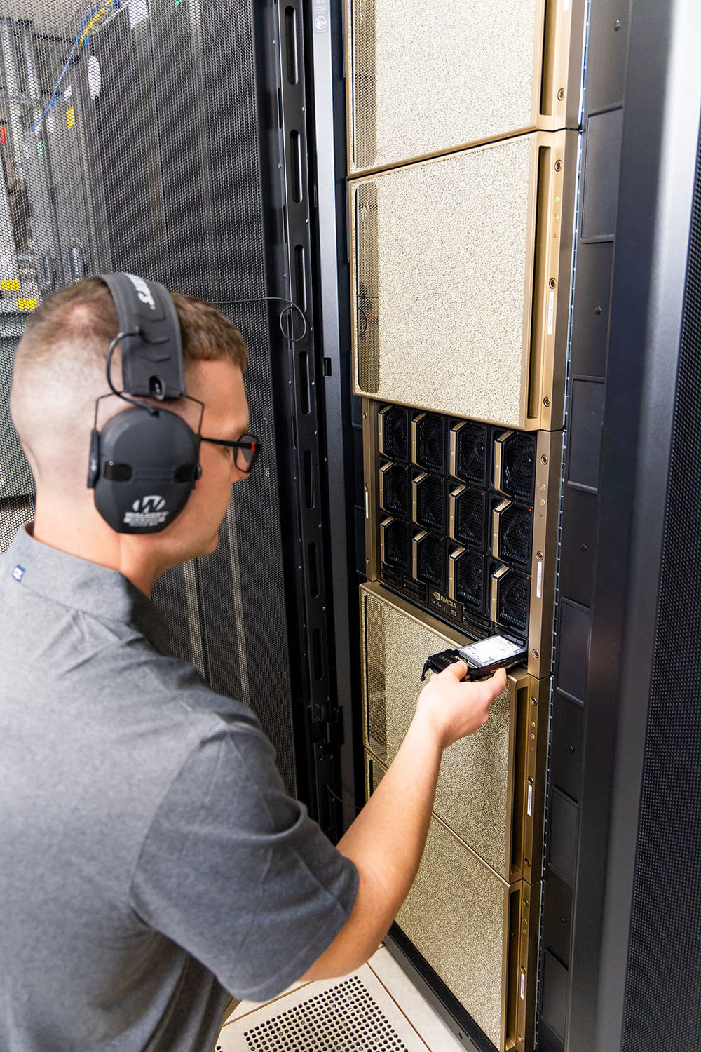 Scott Data staff inspecting cabinets
